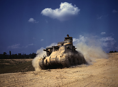 brown tank on sand during daytime thumbnail