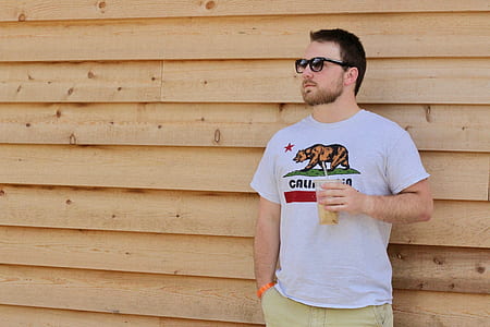 man standing behind wall thumbnail