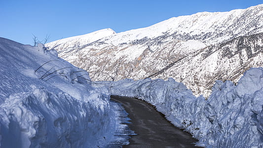 valley between mountain covered with snow thumbnail