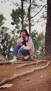 Woman Sitting Under Tree thumbnail