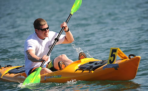 man on boat during daytime thumbnail