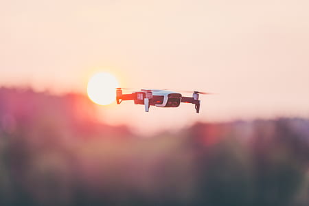 flying quadrone in the sky selective focus photography thumbnail
