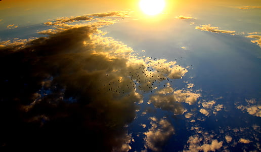 yellow sun beside clouds thumbnail