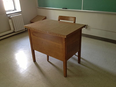brown wooden desk inside classroom thumbnail