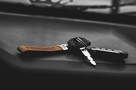 close-up photography of key with fob and keychain thumbnail