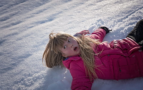 girl lying on snow thumbnail