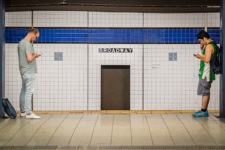 two men standing in room thumbnail
