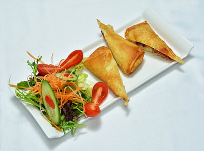 fried dish with vegetable salad side dish on plate thumbnail