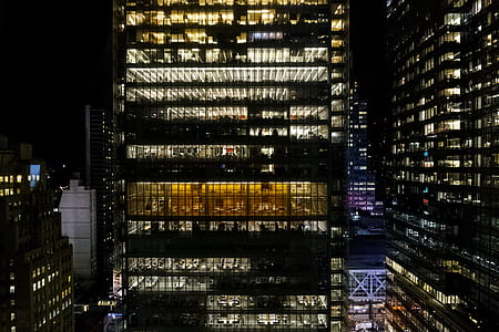 photo of high rise buildings during nighttime thumbnail