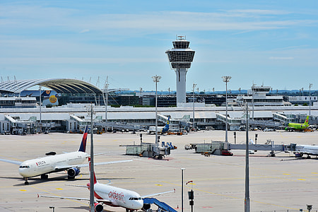 aerial photography of two airplanes parking on airport during daytime thumbnail