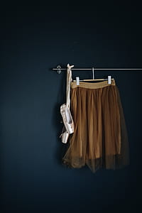 women's brown skirt hanging on wall thumbnail