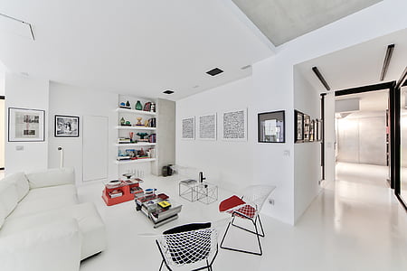 white and black chair arranged beside white table thumbnail