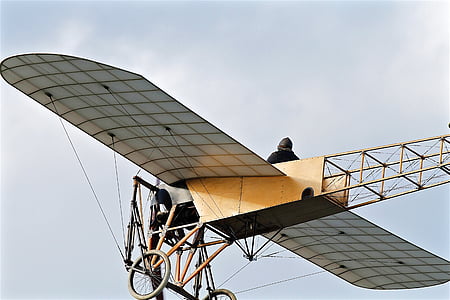 vintage airplane flying during daytime thumbnail