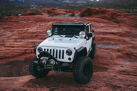 white Jeep Wrangler SUV mountain thumbnail