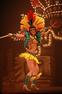 woman wearing traditional dancing outfit while dancing on stage thumbnail