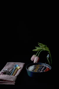 blue ceramic bowl beside blue and yellow spoons thumbnail