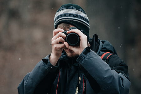 man taking photo wearing black jacket thumbnail