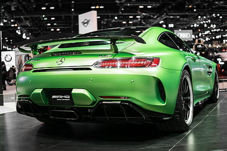 green Mercedes-Benz coupe inside showroom thumbnail