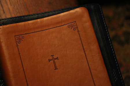 holy bible on black surface thumbnail