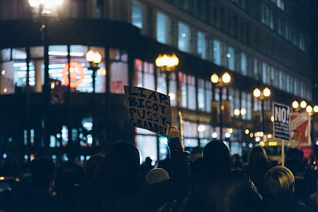 group of people having rally infront of building thumbnail
