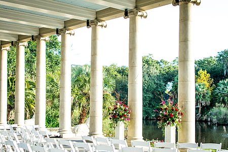 white wooden dining set near lake and trees at daytime thumbnail