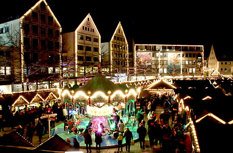 people walking on Christmas market at nighttime thumbnail