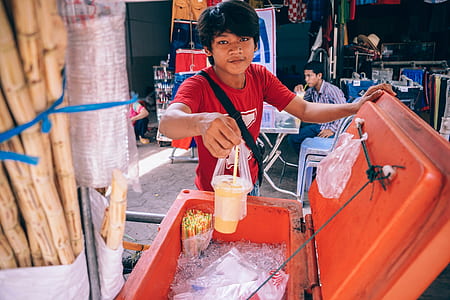 Man Holding Plastic Cup thumbnail