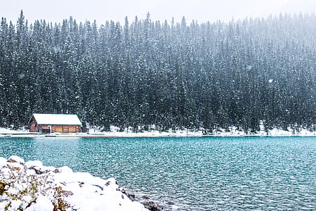 bodies of water near house filled by snow photograph thumbnail