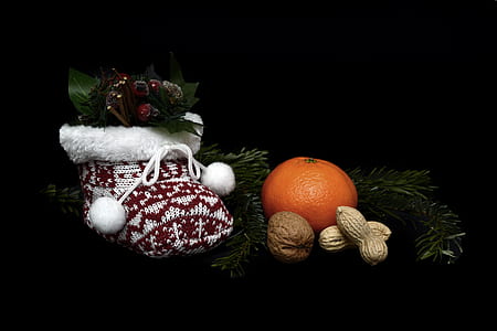 orange fruit and nut on black plate thumbnail