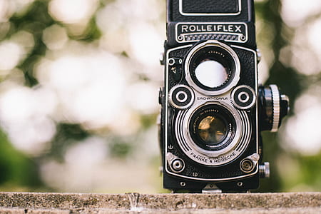selective focus photo of black Rolleiflex twin lens camera thumbnail