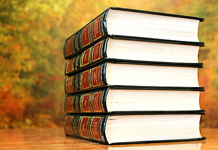 five stacked hardbound books thumbnail