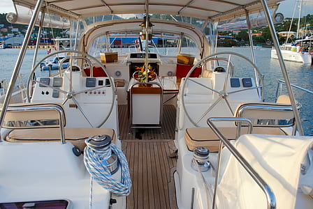 white powerboat docked on harbor thumbnail