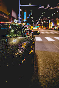 black Lamborghini with water drops during night time thumbnail