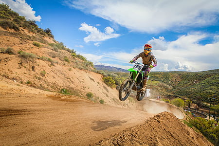 Human Riding Motor and Jumped Under Blue Sky during Daytime thumbnail