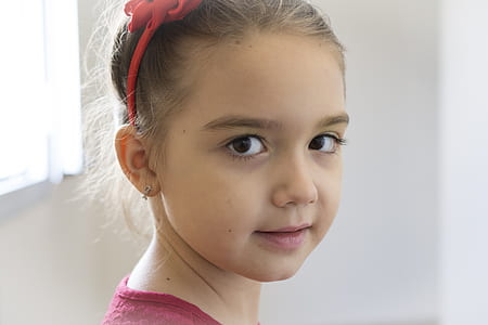 girl wearing pink shirt and alice band thumbnail