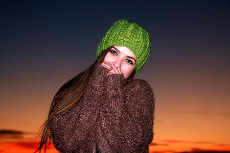 women's green knit cap under sunset thumbnail