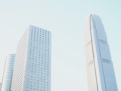 architectural photography of two white high-rise buildings thumbnail