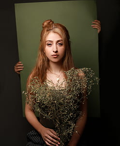 woman standing behind the wall thumbnail