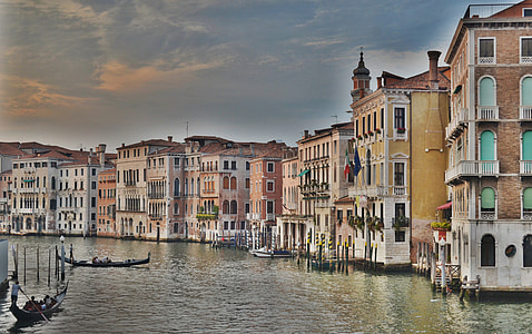 beige concrete buildings near body of water thumbnail