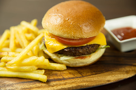 Cheeseburger in brioche bun with fries and ketchup thumbnail