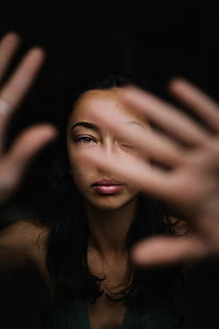 woman raising both hands thumbnail