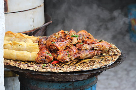 close-up photo of grilled meta and baked bread on brown wicker tray thumbnail