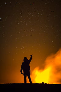 person raising his hands forming letter-y thumbnail