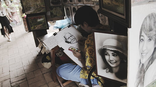 person making man's portrait thumbnail