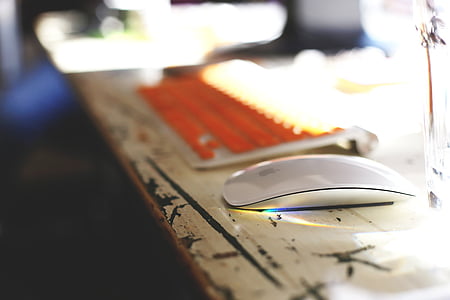 selective focus photography of Apple Magic Mouse on desk thumbnail