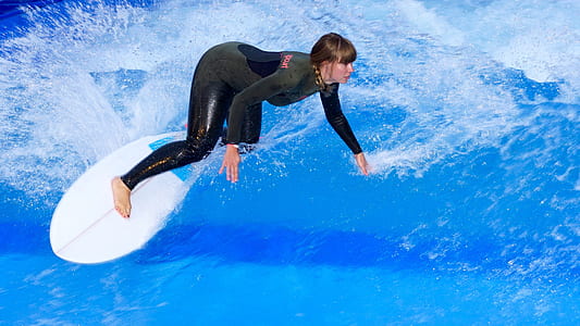 woman surfing on sea waves thumbnail