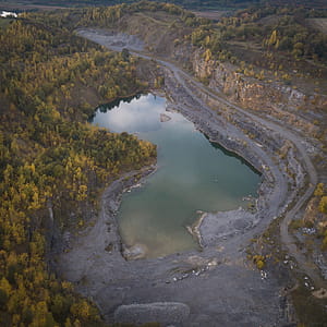 Top View Of Lake Surrounded By Trees thumbnail