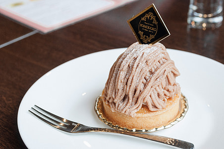 Cupcake with brown noodles on top thumbnail