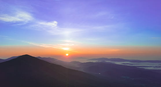 mountains under blue skies thumbnail