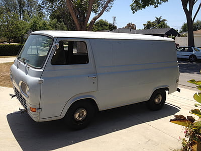 classic white van near brown and green trees thumbnail